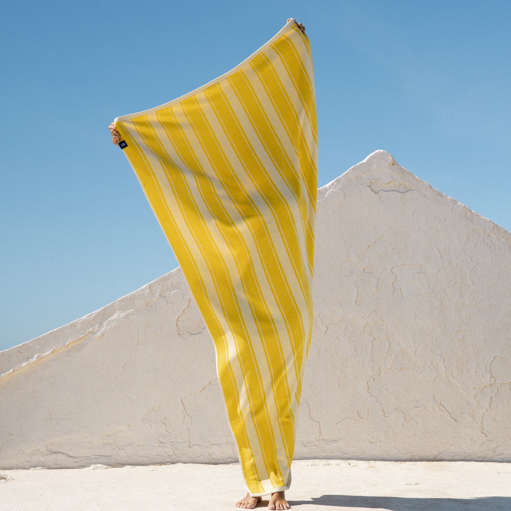 torres-novas-beach-meco-vertical-stripes-towel-yellow-lifestyle-4.png