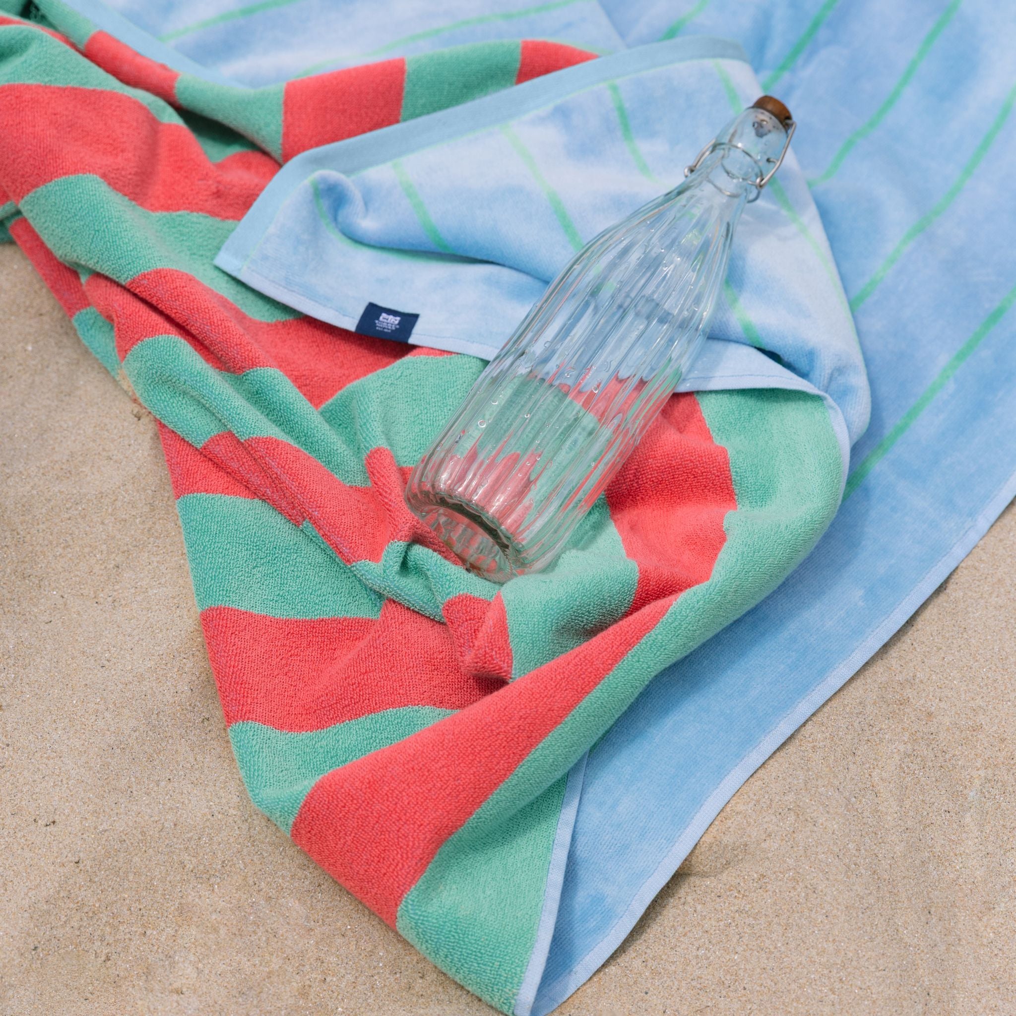 torres-novas-beach-pena-vertical-stripes-towel-green-lifestyle-1_8cea495b-5cec-4026-9b59-bf1421948429.jpg